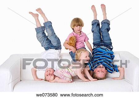 Three boys and a girl making fun on a bench View Large Photo Image Stock Image - Three boys and a girl making fun on a bench. Fotosearch