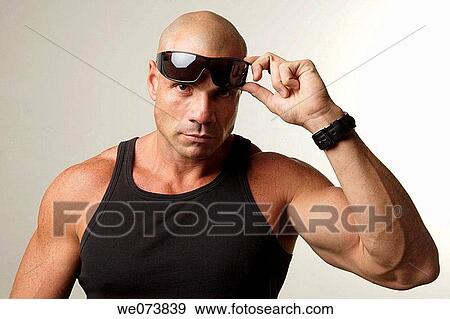 Tough man in his 30s looking at the camera View Large Photo Image Stock Photo - Tough man in his 30s looking at the camera. Fotosearch