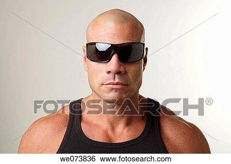Tough man in his 30s looking at the camera View Large Photo Image Stock Photograph - Tough man in his 30s looking at the camera. Fotosearch