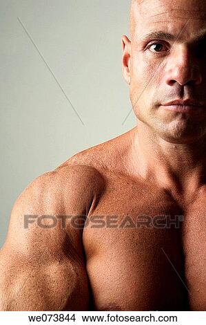 Tough strong man in his 30s looking at the camera View Large Photo Image Picture - Tough strong man in his 30s looking at the camera. Fotosearch