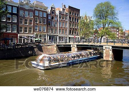 Tour boat on canal, Amsterdam. Holland View Large Photo Image Picture - Tour boat on canal, Amsterdam. Holland. Fotosearch