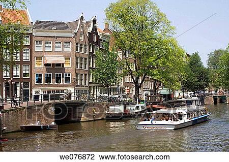 Tour boat on canal, Amsterdam. Holland View Large Photo Image Stock Image - Tour boat on canal, Amsterdam. Holland. Fotosearch
