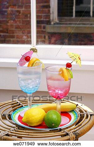 Tropical drinks and fruit in loft by window. View Large Photo Image Stock Photo - Tropical drinks and fruit in loft by window.. Fotosearch