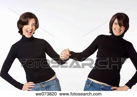 Twin sisters at play View Large Photo Image Stock Image - Twin sisters at play. Fotosearch