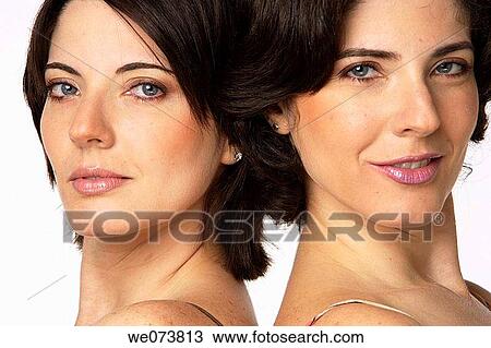 Twin sisters looking at the camera View Large Photo Image Stock Image - Twin sisters looking at the camera. Fotosearch