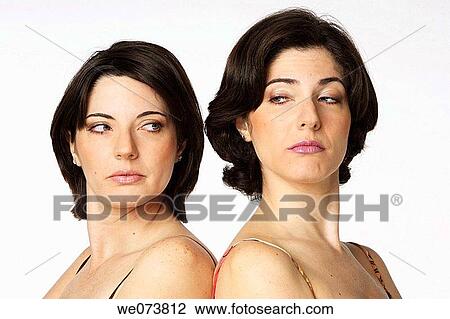Twin sisters mad at each other View Large Photo Image Stock Image - Twin sisters mad at each other. Fotosearch