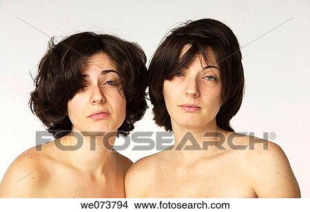 Twin sisters pose just after waking up View Large Photo Image Picture - Twin sisters pose just after waking up. Fotosearch