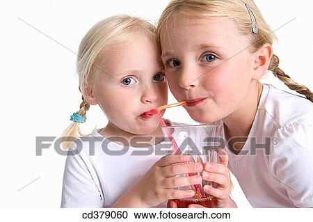 Two blond girls drinking lemonade with a straw View Large Photo Image Stock Image - Two blond girls drinking lemonade with a straw. Fotosearch