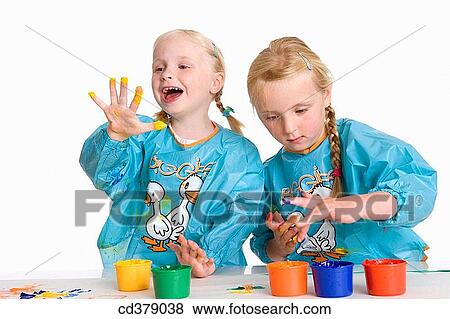 Two blond girls fingerpainting View Large Photo Image Stock Photo - Two blond girls fingerpainting. Fotosearch