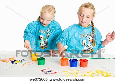 Two blond girls fingerpainting View Large Photo Image Stock Photography - Two blond girls fingerpainting. Fotosearch
