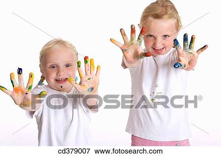 Two blond girls with paint on their fingers View Large Photo Image Stock Photo - Two blond girls with paint on their fingers. Fotosearch