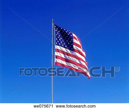 UNITED STATES FLAG. WITH BLUE SKY View Large Photo Image Stock Image - UNITED STATES FLAG. WITH BLUE SKY. Fotosearch