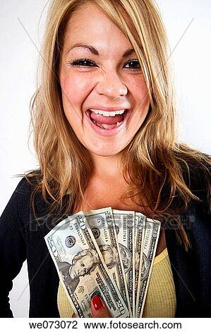 Very happy mid 20's caucasian female in business attire shows off USD$100 in $20 bills in studio portrait. View Large Photo Image Stock Image - Very happy mid 20's caucasian female in business attire shows off USD$100 in $20 bills in studio portrait.. Fotosearch