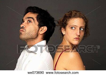 Woman and man back to back in studio View Large Photo Image Stock Image - Woman and man back to back in studio. Fotosearch