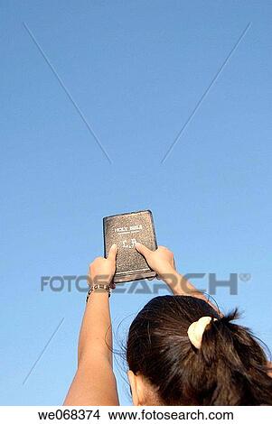 Woman holding Bible View Large Photo Image Picture - Woman holding Bible. Fotosearch
