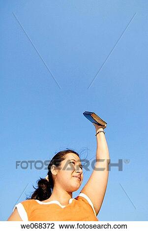Woman holding Bible View Large Photo Image Stock Image - Woman holding Bible. Fotosearch