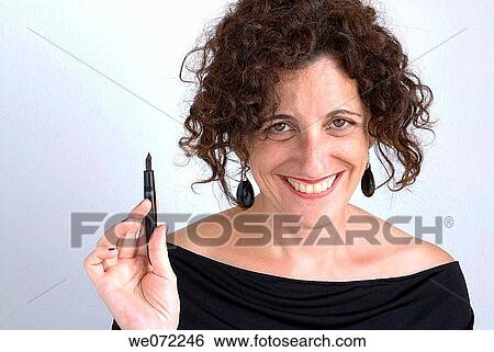 Woman holding fountain pen View Large Photo Image Stock Photograph - Woman holding fountain pen. Fotosearch