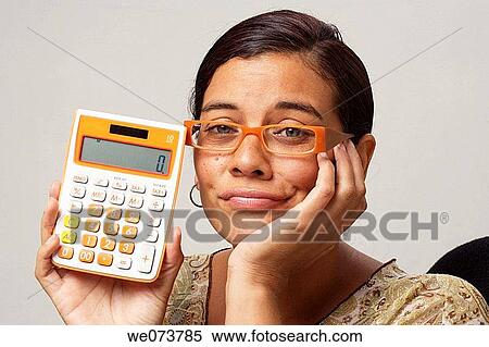 Woman in her 30s with retro sunglasses shows a zero figure on her calculator View Large Photo Image Stock Photography - Woman in her 30s with retro sunglasses shows a zero figure on her calculator. Fotosearch
