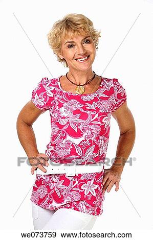 Woman in her 60s poses in a studio setting View Large Photo Image Stock Photo - Woman in her 60s poses in a studio setting. Fotosearch