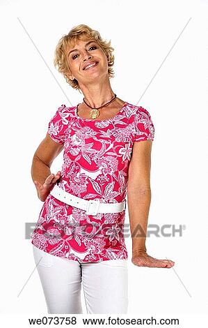 Woman in her 60s poses ina studio setting View Large Photo Image Stock Photo - Woman in her 60s poses ina studio setting. Fotosearch