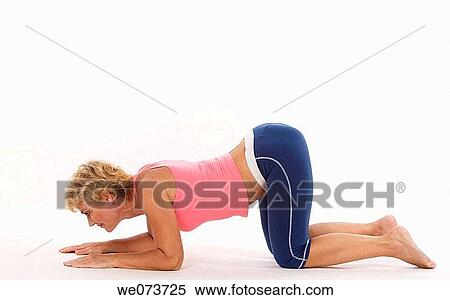 Woman in her 60s stretches in a studio setting View Large Photo Image Stock Photography - Woman in her 60s stretches in a studio setting. Fotosearch