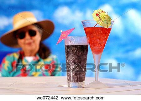 Woman Looking at Tropical Drinks View Large Photo Image Stock Image - Woman Looking at Tropical Drinks. Fotosearch