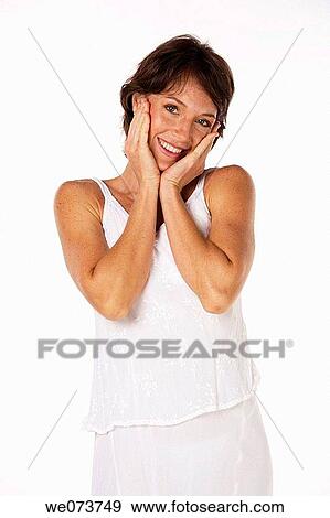Woman posing hands on cheeks View Large Photo Image Stock Photo - Woman posing hands on cheeks. Fotosearch