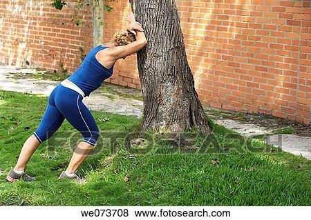Woman resting after exercise View Large Photo Image Stock Photo - Woman resting after exercise. Fotosearch
