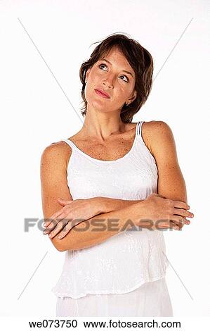 Woman thinking in a studio setting View Large Photo Image Stock Image - Woman thinking in a studio setting. Fotosearch