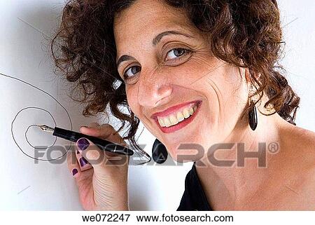 Woman using fountain pen View Large Photo Image Stock Photo - Woman using fountain pen. Fotosearch