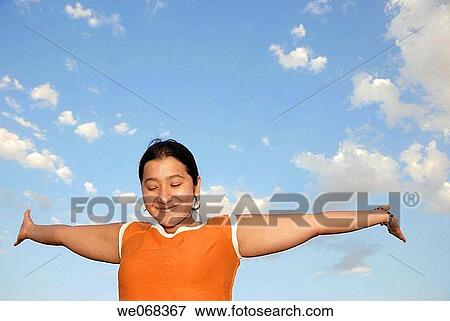 Woman with arms extended. View Large Photo Image Stock Photo - Woman with arms extended.. Fotosearch