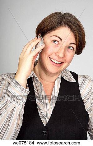 Picture - woman with mobile phone. Fotosearch