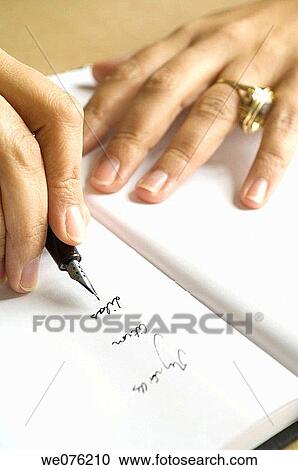 Woman writing french words of savours or perfumes on a book View Large Photo Image Stock Image - Woman writing french words of savours or perfumes on a book. Fotosearch