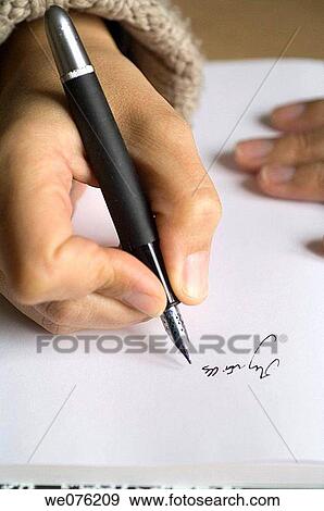 Woman writing french words of savours or perfumes on a book View Large Photo Image Stock Photo - Woman writing french words of savours or perfumes on a book. Fotosearch