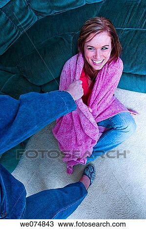 Woman's hand pulling on a blanket that is wrapped around a young woman. View Large Photo Image Stock Image - Woman's hand pulling on a blanket that is wrapped around a young woman.. Fotosearch