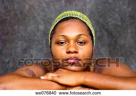 Young black woman resting her head on her hands. View Large Photo Image Stock Image - Young black woman resting her head on her hands.. Fotosearch