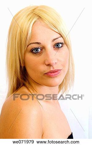 Young blond woman gazes into the camera in studio portrait, Los Angeles, California, USA View Large Photo Image Stock Photo - Young blond woman gazes into the camera in studio portrait, Los Angeles, California, USA. Fotosearch