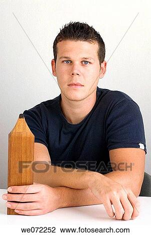 Young man with big pencil View Large Photo Image Stock Image - Young man with big pencil. Fotosearch