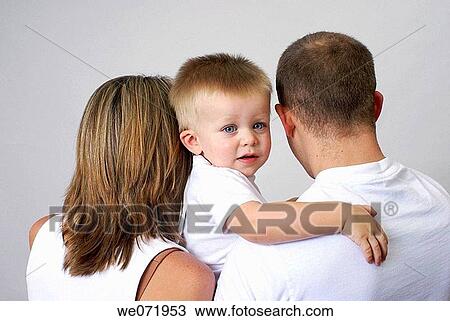 Young son looking over dad's shoulder. View Large Photo Image Stock Image - Young son looking over dad's shoulder.. Fotosearch