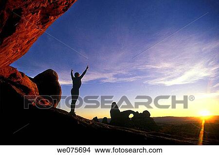 YOUNG WOMAN EXERCISING IN ARCHES NATIONAL PARK View Large Photo Image Picture - YOUNG WOMAN EXERCISING IN ARCHES NATIONAL PARK. Fotosearch