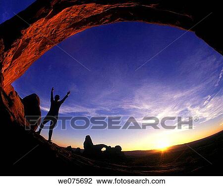YOUNG WOMAN EXERCISING IN ARCHES NATIONAL PARK View Large Photo Image Stock Image - YOUNG WOMAN EXERCISING IN ARCHES NATIONAL PARK. Fotosearch