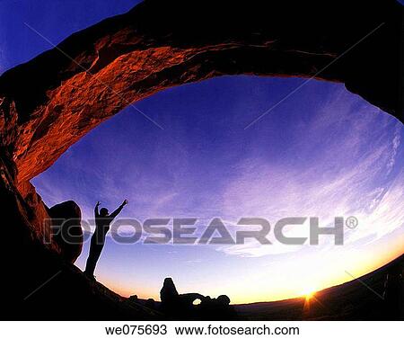 YOUNG WOMAN EXERCISING IN ARCHES NATIONAL PARK View Large Photo Image Stock Image - YOUNG WOMAN EXERCISING IN ARCHES NATIONAL PARK. Fotosearch