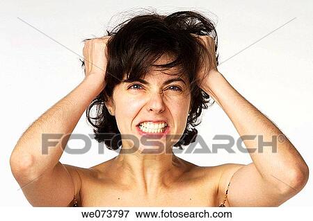 Young woman in her 30s desperately grabbing her hair View Large Photo Image Stock Photo - Young woman in her 30s desperately grabbing her hair. Fotosearch