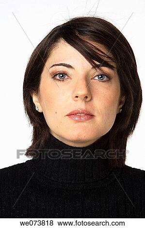 Young woman in her 30s posing in a studio setting View Large Photo Image Stock Photo - Young woman in her 30s posing in a studio setting. Fotosearch