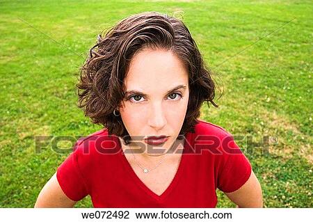 Young woman making an odd face. View Large Photo Image Stock Image - Young woman making an odd face.. Fotosearch