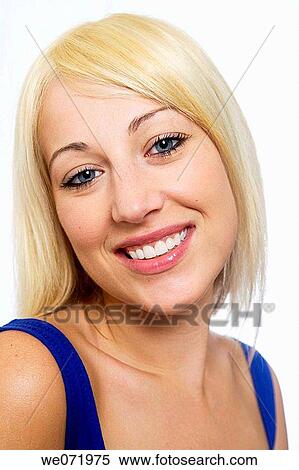 Young woman smiles while posing for a studio portrait in Los Angeles, California, USA View Large Photo Image Stock Photography - Young woman smiles while posing for a studio portrait in Los Angeles, California, USA. Fotosearch