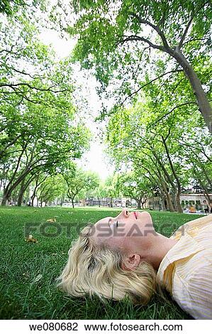 30 year old woman on grass View Large Photo Image Stock Image - 30 year old woman on grass. Fotosearch