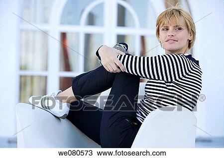 Stock Image - absent-mindedness, carefree, blond, absorbed, Absent-minded. Fotosearch