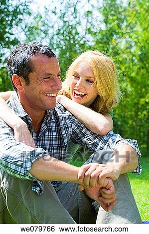 amusement, bond, blond, black hair, affection View Large Photo Image Stock Photograph - amusement, bond, blond, black hair, affection. Fotosearch