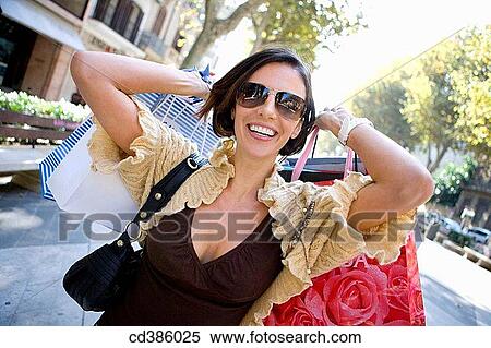 amusement, brunette, bag, Arms raised, addiction View Large Photo Image Stock Photography - amusement, brunette, bag, Arms raised, addiction. Fotosearch